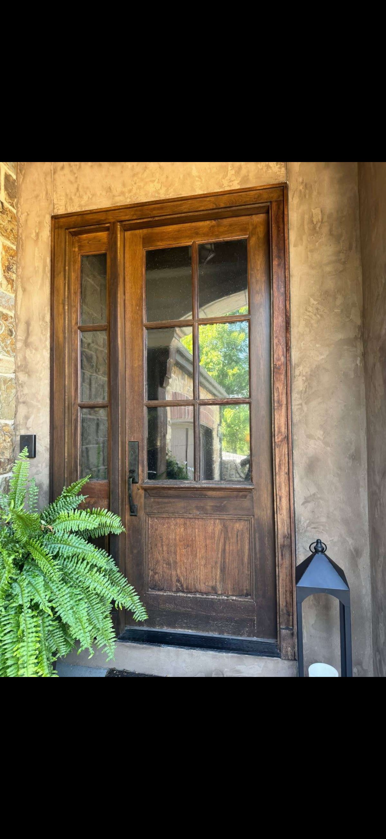 Weathered wood entry door before professional restoration